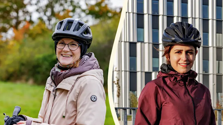Två kvinnor med cykelhjälm på huvudet.
